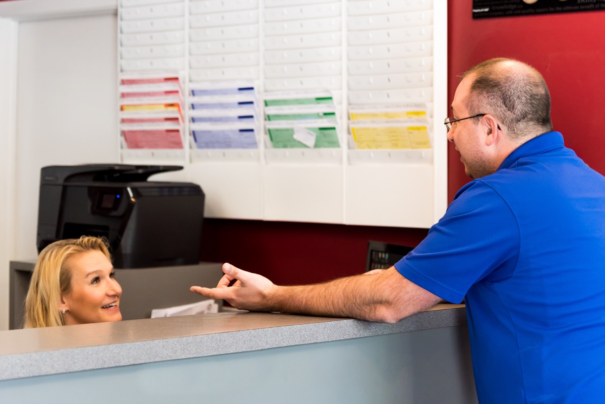 Jersey Automotive front desk helping a customer